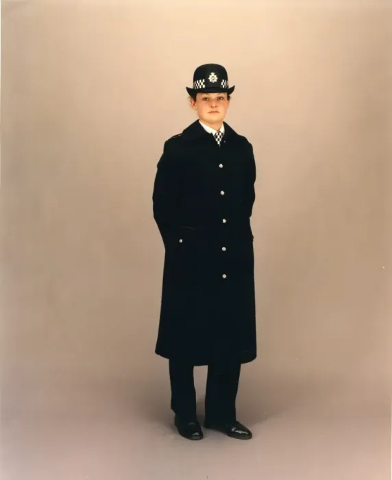 Framed Print : Woman police officer in coat and bowler hat, London Framed Print : Woman police officer in coat and bowler hat, London