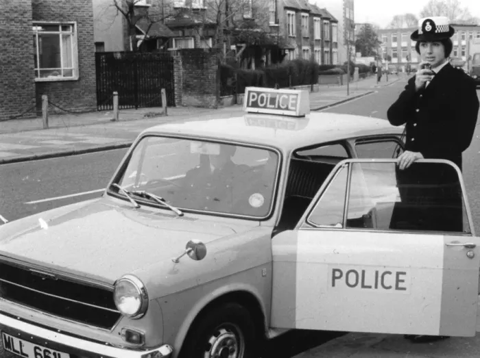 Framed Print : Woman police officer on duty in London