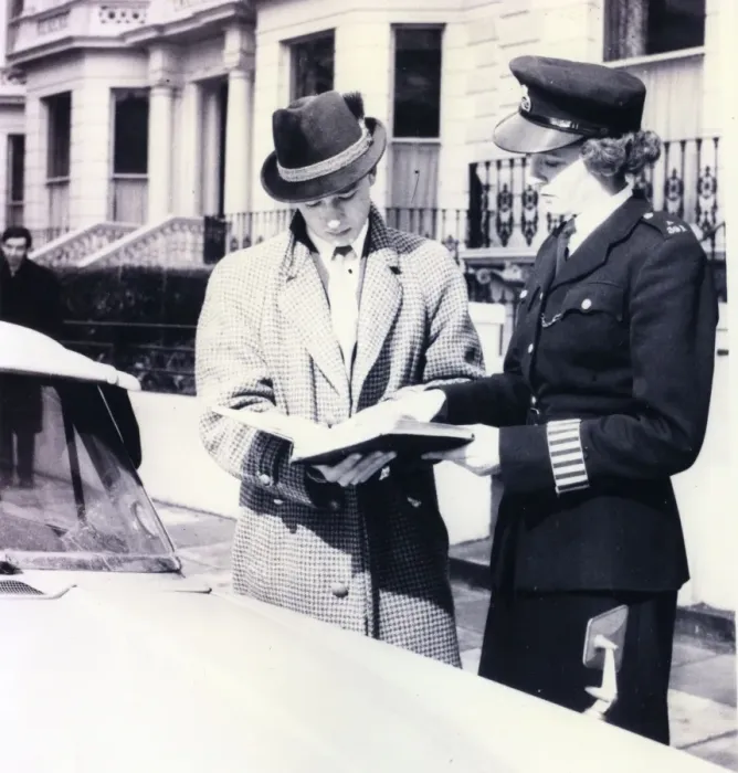 Framed Print : Woman police officer helping a driver, London Framed Print : Woman police officer helping a driver, London
