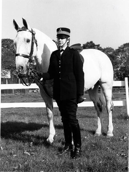 Woman police officer with horse, London