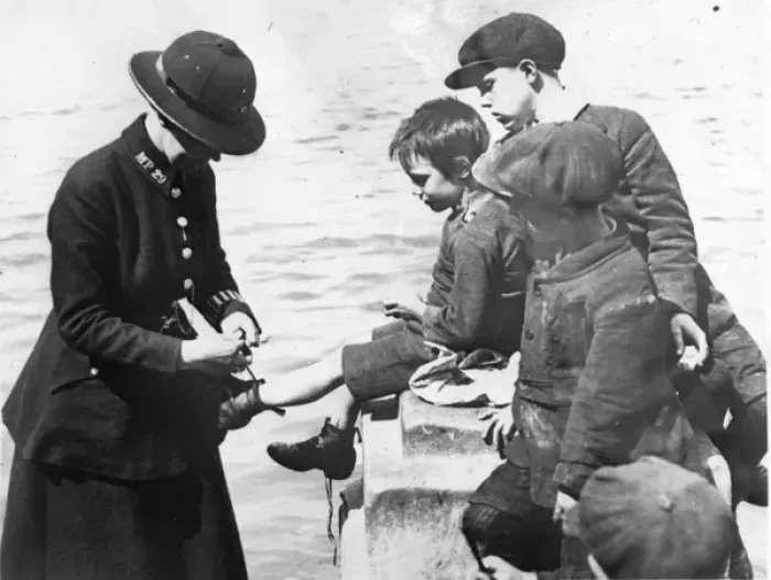 Framed Print : Woman police officer with small boys, London Framed Print : Woman police officer with small boys, London