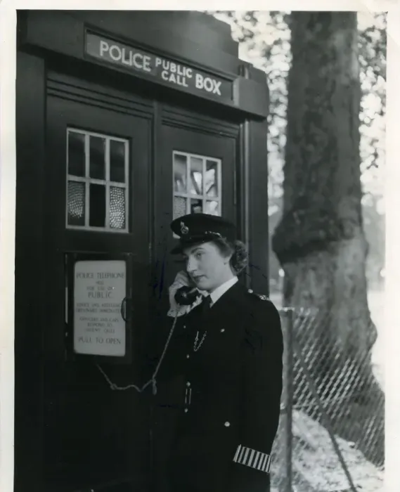 Framed Print : Woman police officer on telephone in a London street Framed Print : Woman police officer on telephone in a London street