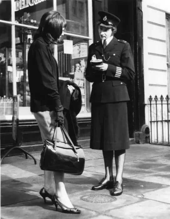Framed Print : Woman police officer and woman with handbag, London Framed Print : Woman police officer and woman with handbag, London