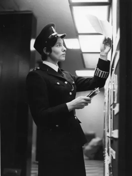 Framed Print : Woman police officer at work in a London police station Framed Print : Woman police officer at work in a London police station