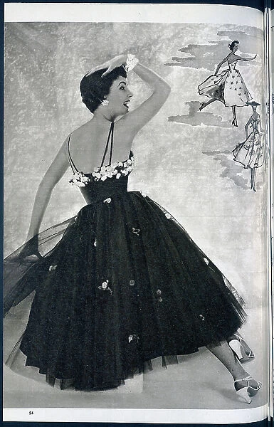 A woman posing in a summer dress. Date: 1954