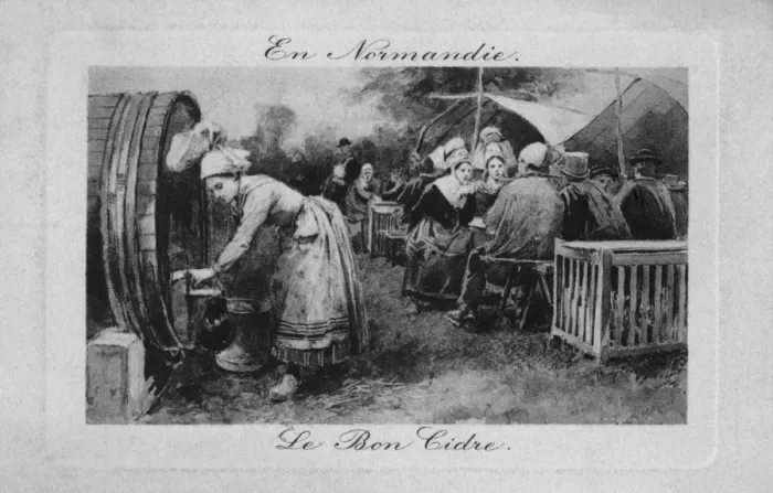 Framed Print : A woman pouring cider in Normandie, France Framed Print : A woman pouring cider in Normandie, France