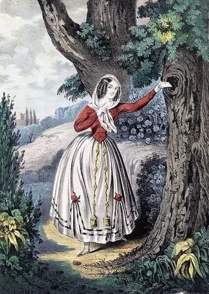 Woman putting a love letter in a tree