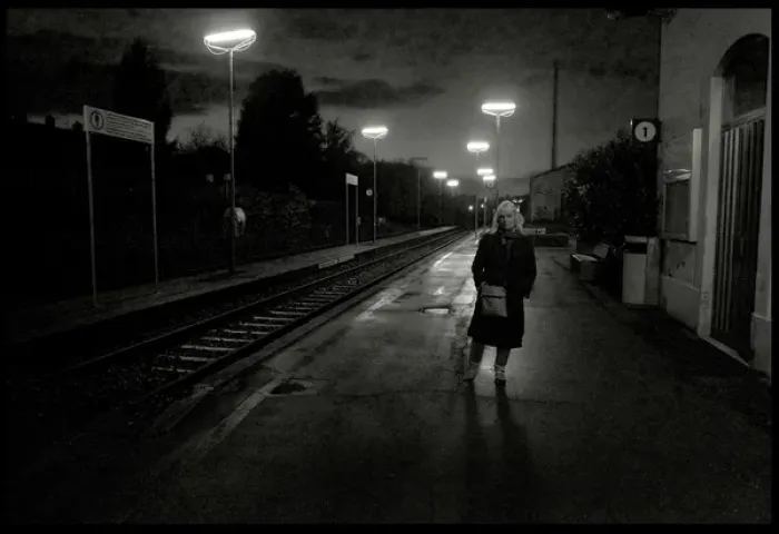 Framed Print : Woman on railway station platform late evening, Italy Framed Print : Woman on railway station platform late evening, Italy