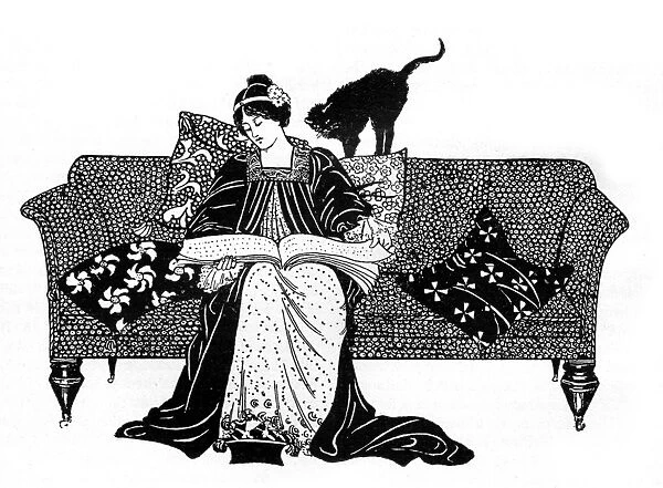 Woman reading with cat