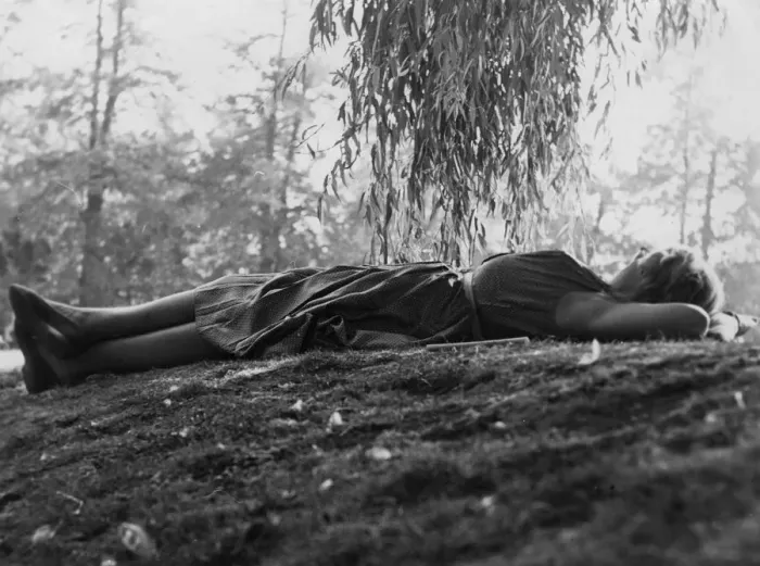Framed Print : Woman relaxing on grass under a tree Framed Print : Woman relaxing on grass under a tree