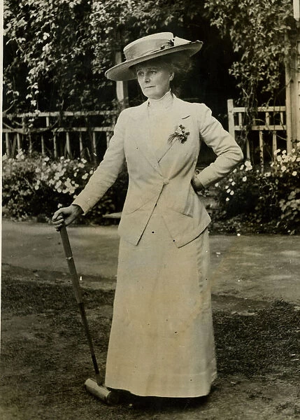 Woman resting during a game of croquet