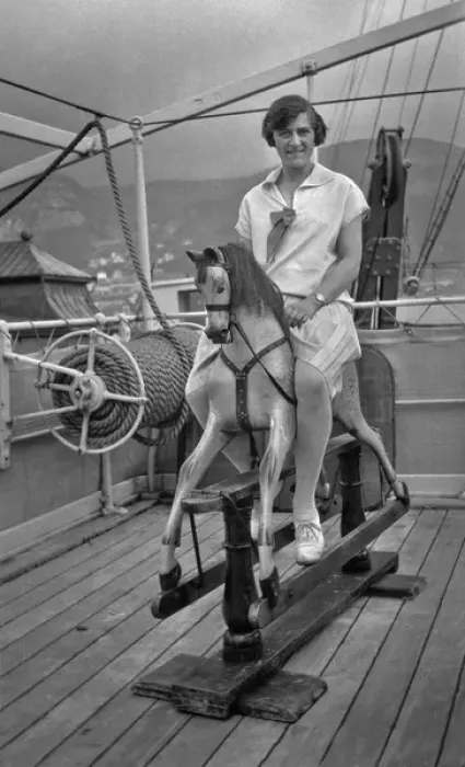 Framed Print : Woman riding a hobby horse on board ship Framed Print : Woman riding a hobby horse on board ship