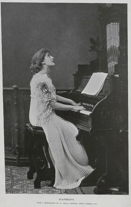 Framed Print : Woman seated at keyboard of a pipe organ, studio portrait Framed Print : Woman seated at keyboard of a pipe organ, studio portrait