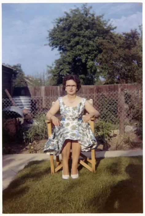 Framed Print : Woman sitting in garden chair - neat suburban garden Framed Print : Woman sitting in garden chair - neat suburban garden