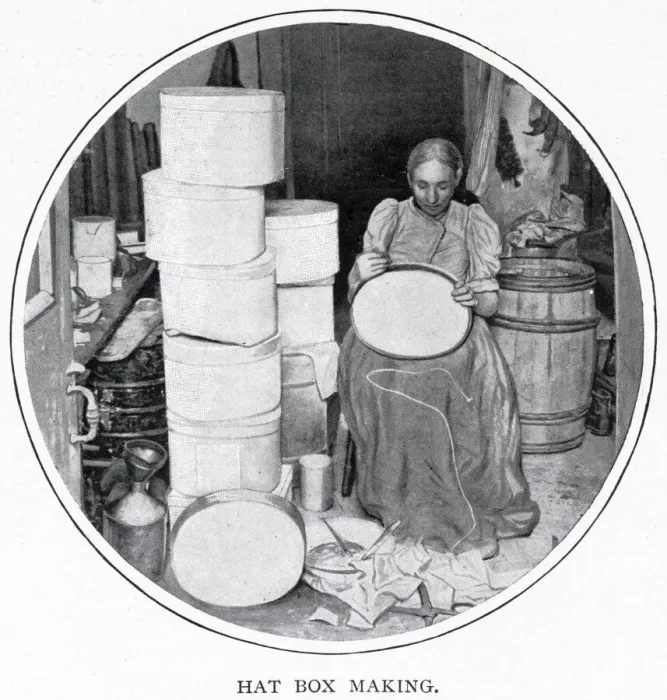 Framed Print : Woman sitting in her own home in South London, making the hat boxes for a supplier that Framed Print : Woman sitting in her own home in South London, making the hat boxes for a supplier that