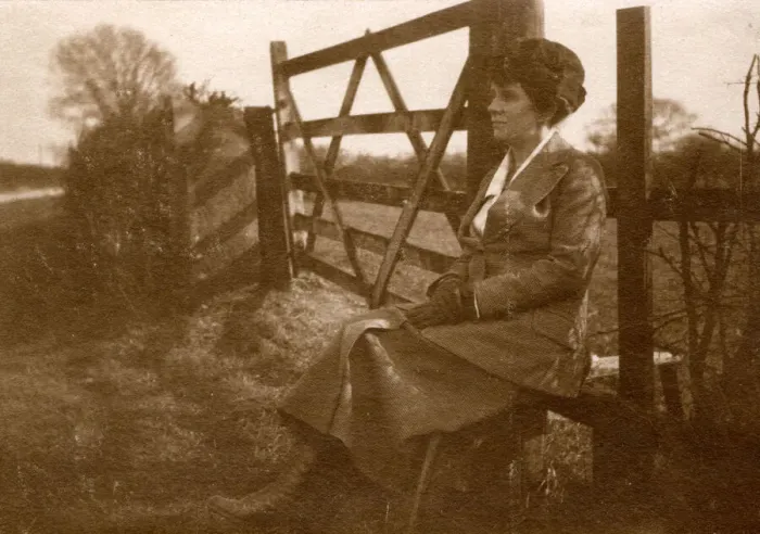 Framed Print : Woman sitting on a stile by a five-bar gate Framed Print : Woman sitting on a stile by a five-bar gate