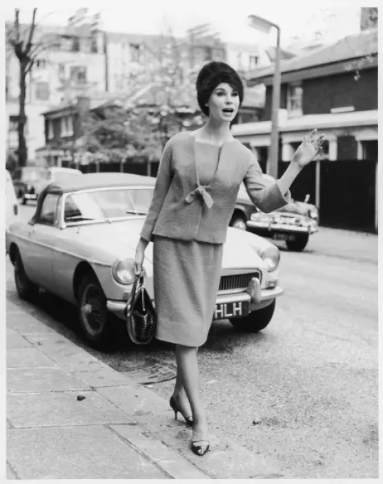 Framed Print : TAXI. A woman in smart stylish suit of straight knee-length skirt Framed Print : TAXI. A woman in smart stylish suit of straight knee-length skirt