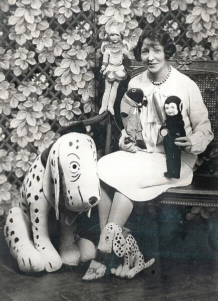 Woman with soft toys including Dismal Desmond