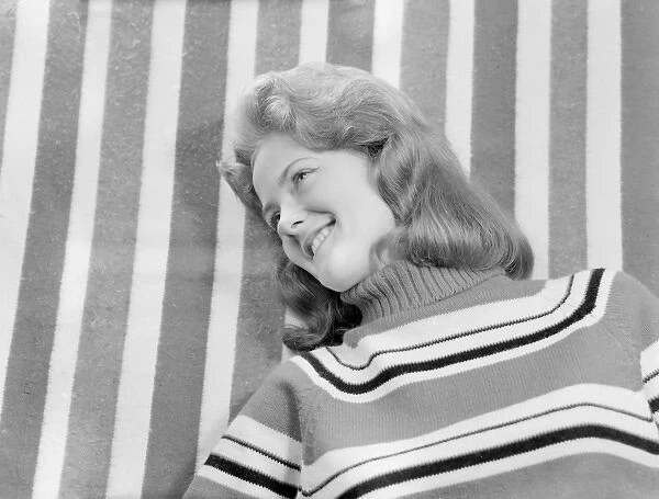 Woman with stripy jumper and background