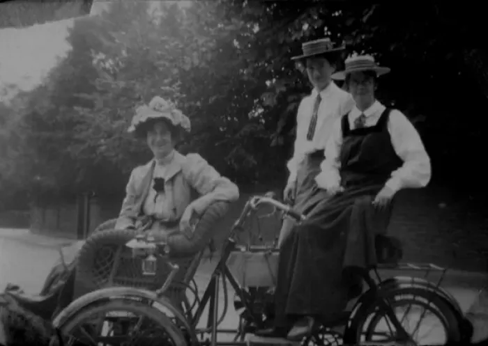 Framed Print : Woman and students on motorised bicycle Framed Print : Woman and students on motorised bicycle