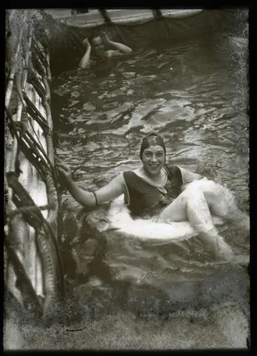Framed Print : Woman swimming with a lifebelt in a pool Framed Print : Woman swimming with a lifebelt in a pool