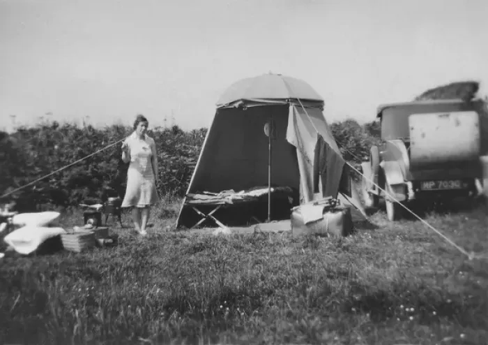 Framed Print : Woman with tent and parked car Framed Print : Woman with tent and parked car