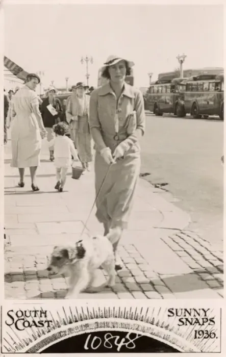 Framed Print : Woman with terrier on a lead at the seaside Framed Print : Woman with terrier on a lead at the seaside