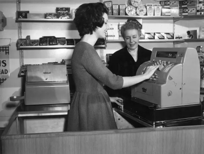 Framed Print : WOMAN USES CASH REGISTER Framed Print : WOMAN USES CASH REGISTER