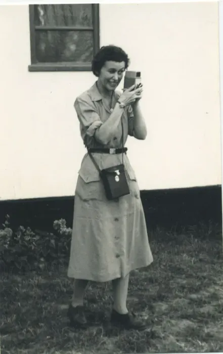 Framed Print : A woman using what looks to be a cine camera, probably a Bell and Howell 252 Framed Print : A woman using what looks to be a cine camera, probably a Bell and Howell 252