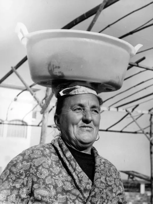 Framed Print : Woman with wet washing on her head, Italy Framed Print : Woman with wet washing on her head, Italy