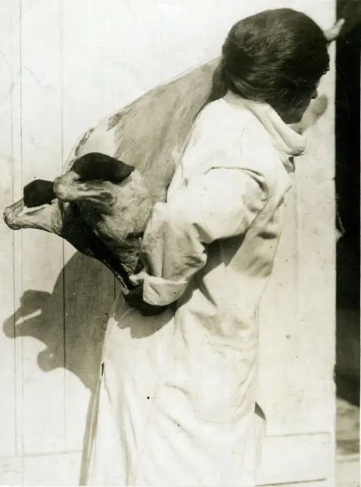 Framed Print : Woman working in cold storage carrying meat, WW1 Framed Print : Woman working in cold storage carrying meat, WW1