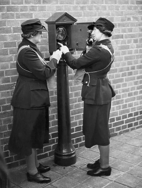 Women of the Auxiliary Fire Service using a telephone, WW2