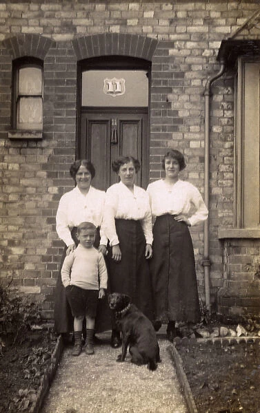 Three women and a boy with a dog
