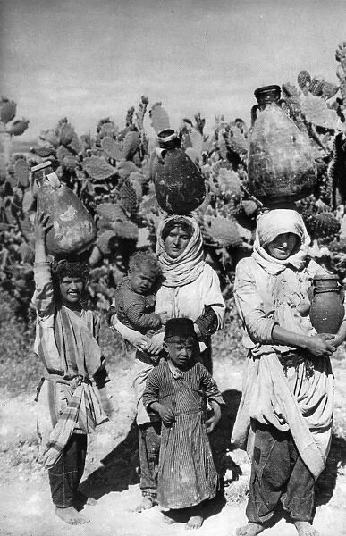 Women carrying water, Holy Land