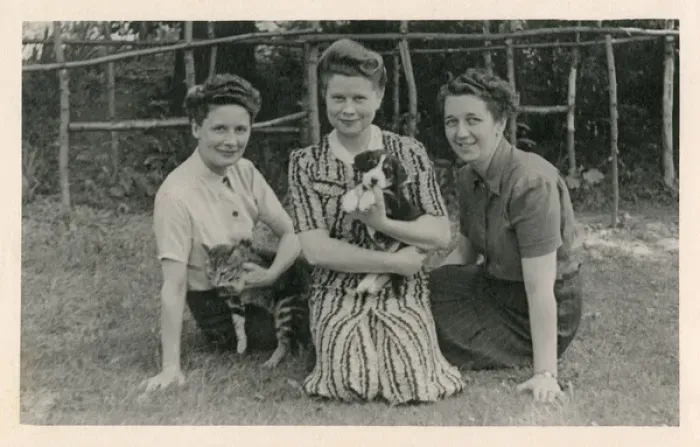 Framed Print : Three women with cat and puppy in a garden Framed Print : Three women with cat and puppy in a garden