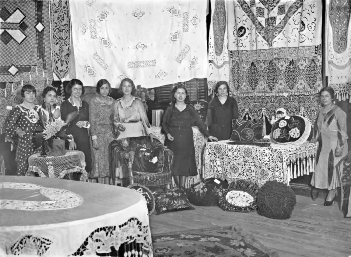 Framed Print : Women with display of homemade arts and crafts Framed Print : Women with display of homemade arts and crafts