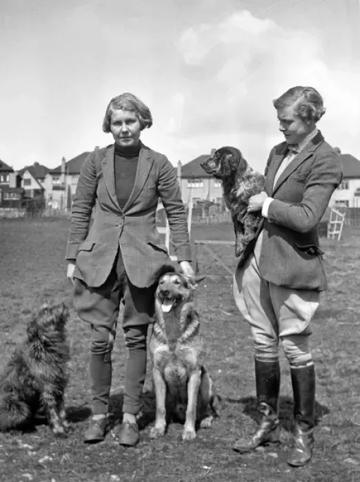 Framed Print : Two women with three dogs in a field Framed Print : Two women with three dogs in a field