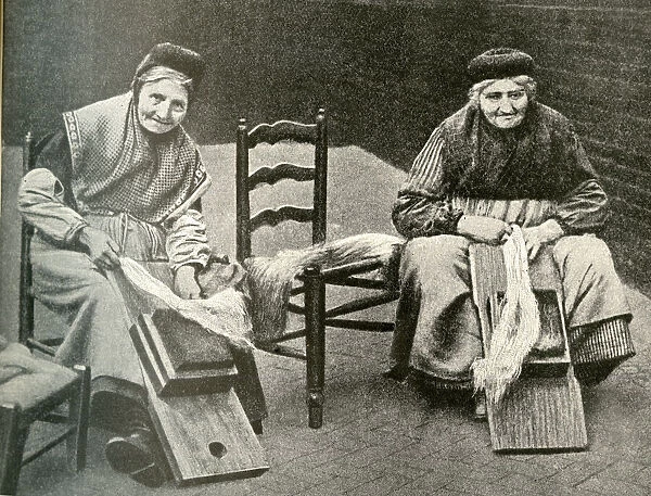 Women drawing flax to turn it into yarn, Belgium