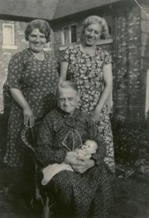 Framed Print : Three women in back garden with doll Framed Print : Three women in back garden with doll