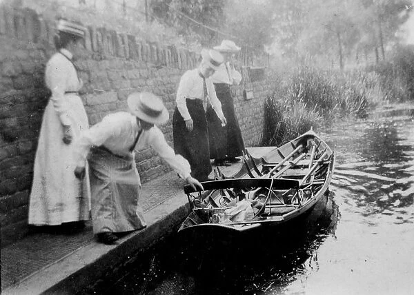 Women getting onto rowing boat