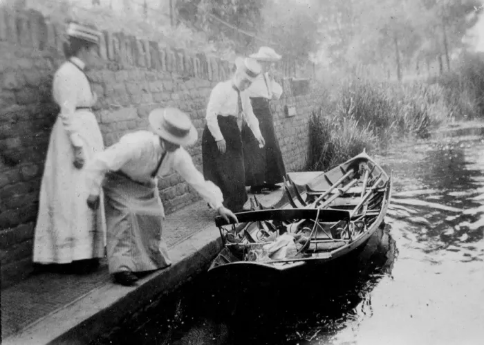 Framed Print : Women getting onto rowing boat Framed Print : Women getting onto rowing boat