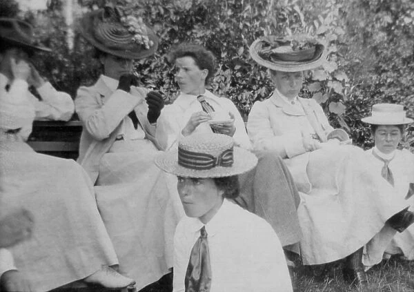 Women in hats in garden