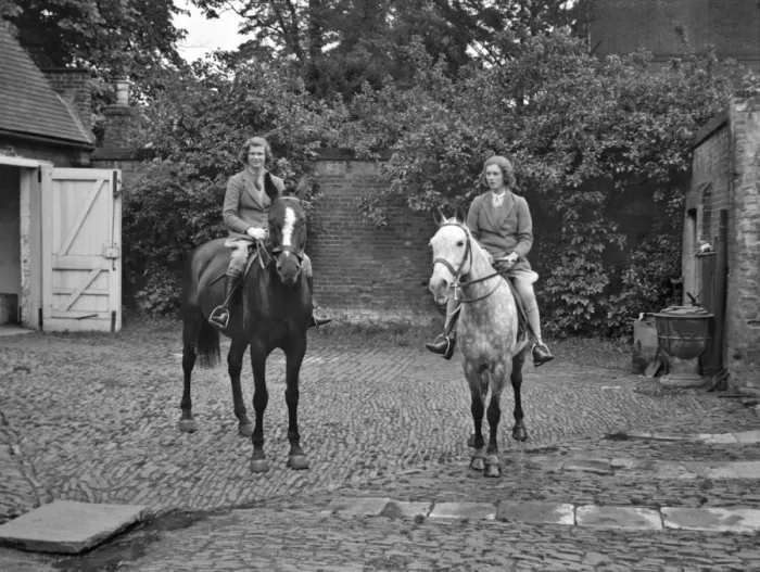Framed Print : Two women on horseback in stable yard Framed Print : Two women on horseback in stable yard