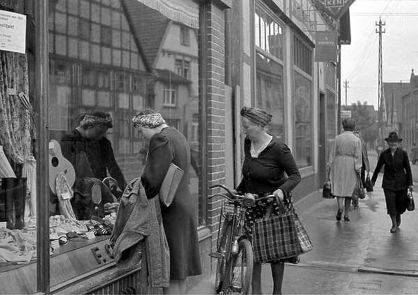 Women looking in a shop window