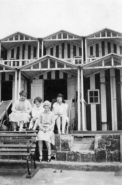 Four women outside a beach hut, Walton, Essex