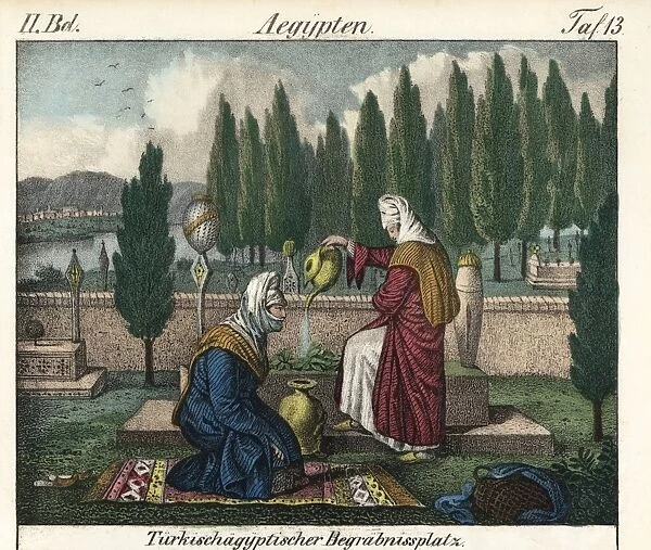 Two women praying at a tomb in a Turkish-Egyptian cemetery
