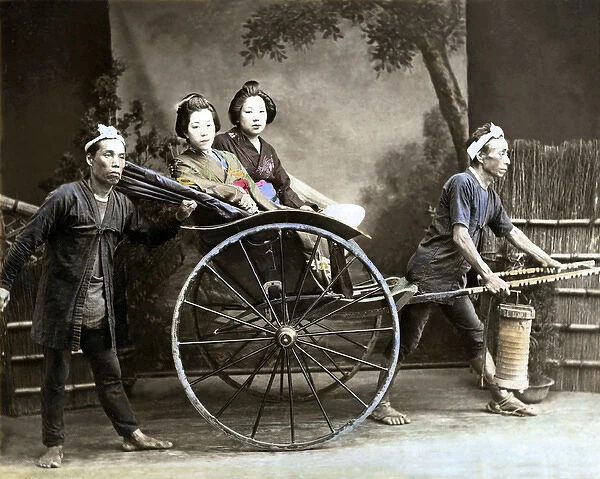 Two women in rickshaw, Japan