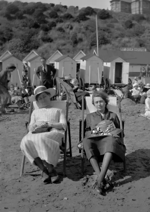 Framed Print : Two women sitting on a beach Framed Print : Two women sitting on a beach