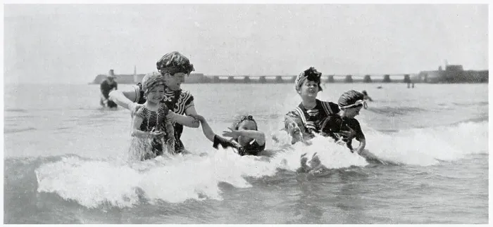 Framed Print : Two women taking their children for an early morning slash in the sea in Trouville. Date: August 1905 Framed Print : Two women taking their children for an early morning slash in the sea in Trouville. Date: August 1905