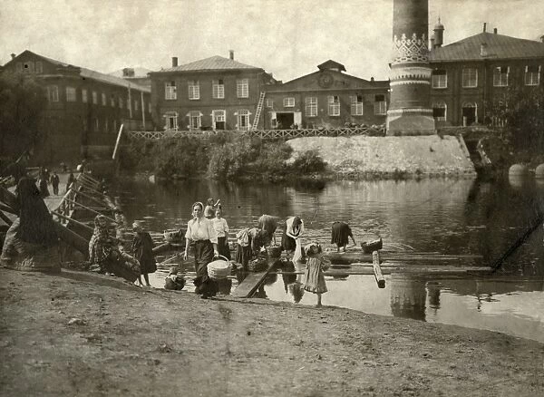 Women Washing Clothes in a River